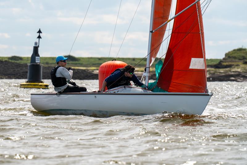 Royal Corinthian Yacht Club Otter Nathan Flynn, helming for Ian Simons, on Cheque Mate 157, downwind leg during the 28th edition of the Squib Gold Cup at Royal Corinthian Yacht Club photo copyright Petru Balau Sports Photography / sports.hub47.com taken at Royal Corinthian Yacht Club and featuring the Squib class