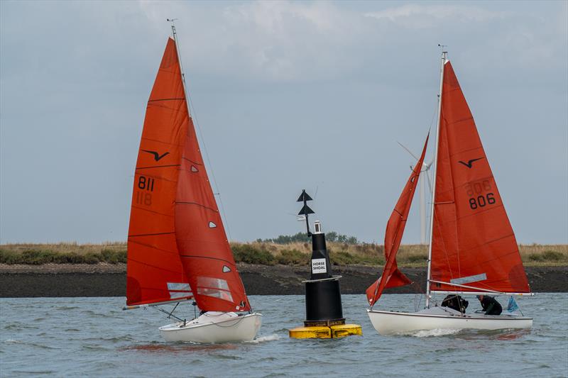 Close battle between Ray Apthorp and Ian Simons on Nemesis 806 and Micky Wright and Alex Porteous, on Spoof 811, on the 7th day of Burnham Week 2024 photo copyright Petru Balau Sports Photography / sports.hub47.com taken at Royal Corinthian Yacht Club, Burnham and featuring the Squib class