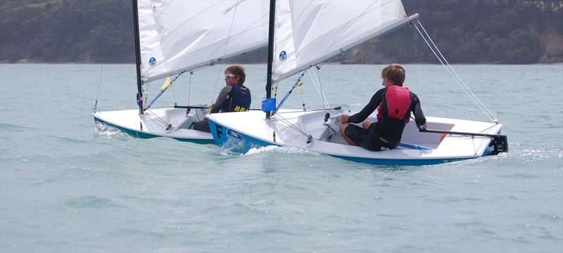 In 2000 the Sail One fibreglass Starlings became a welcome option to parents needing a low-maintenance, competitive boat. George Gautrey (left) and William Linkhorn (right) are battling for control at the 2013 Match Racing Nationals, won by William. - photo © Brian Peet
