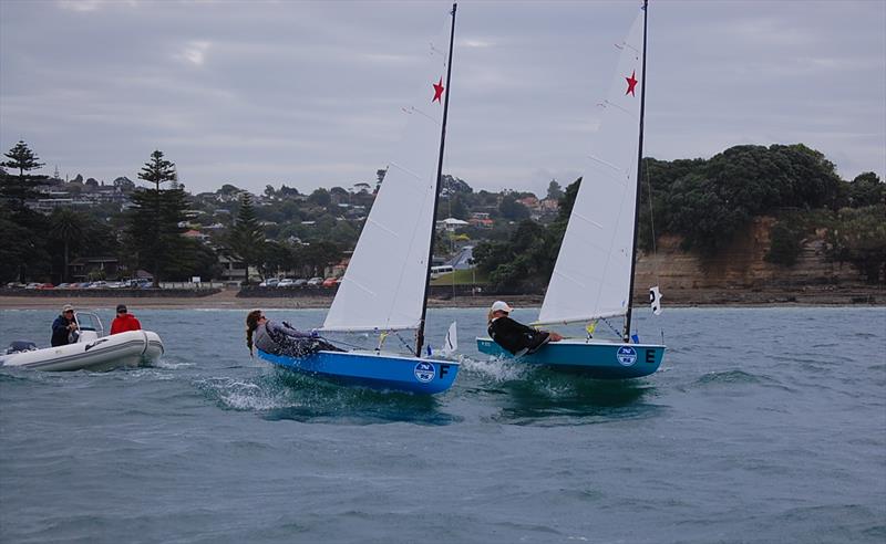 Match Racing, Murrays Bay, 2012. Jordelle Simkin (Taranaki) and Alice Noyer (Northland) battling for advantage while under close scrutiny from race judge Don le Page. Alice was the first female to win the event in its 32-year history. - photo © Brian Peet