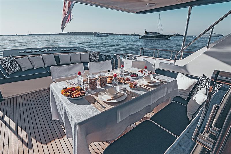 Breakfast on the aft deck of Lady Amanda photo copyright West Nautical taken at  and featuring the Superyacht class