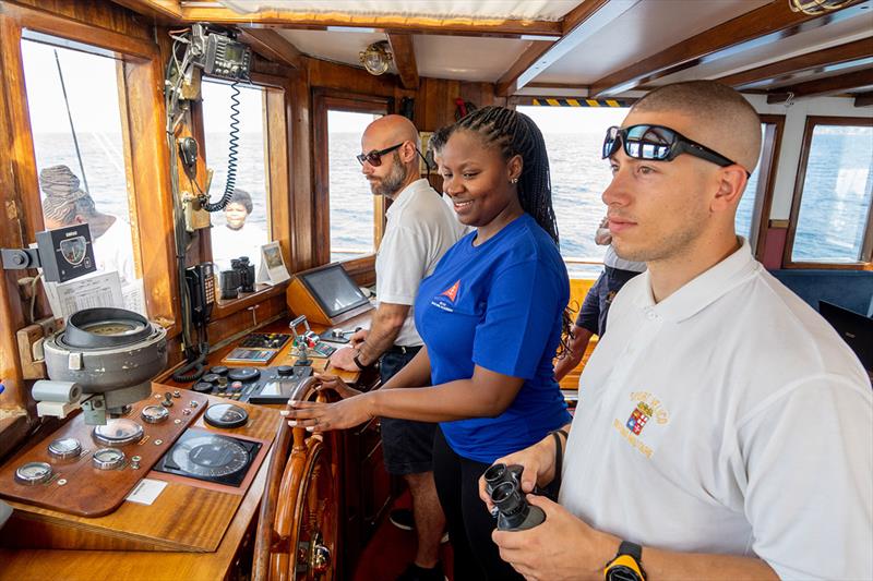 Philisande Gwala steering the Tall ship Nave Italia photo copyright Merlo Fotografia taken at Royal Cape Yacht Club and featuring the Tall Ships class