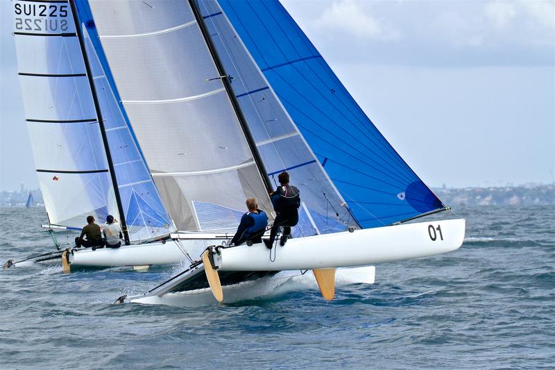 Brett and Rex Sellers (NZL) battle with Jorg Steiner and Michael Gloor (SUI) for the lead in Race 10 - Int Tornado Worlds - Day 5, presented by Candida, January 10, photo copyright Richard Gladwell taken at Takapuna Boating Club and featuring the Tornado class