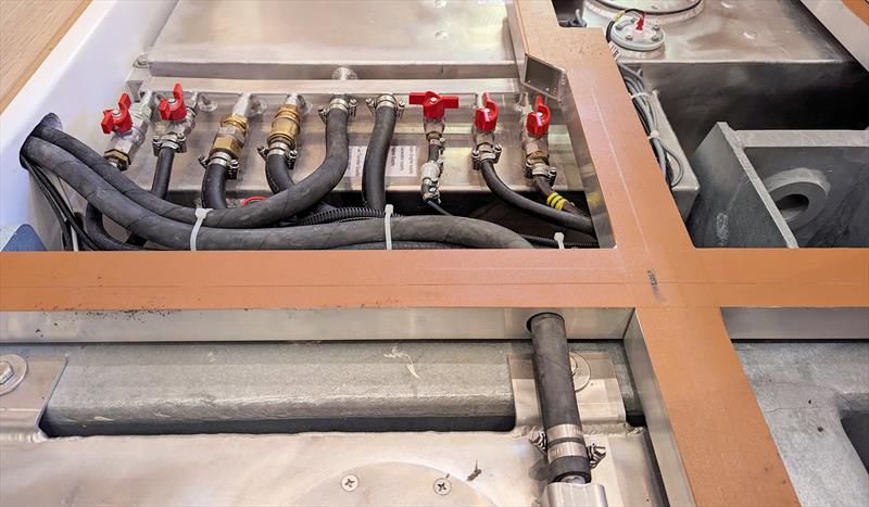 Tanks suspended from the steel frame with cable runs - note the clear labelling on the pipes - photo © Mark Jardine